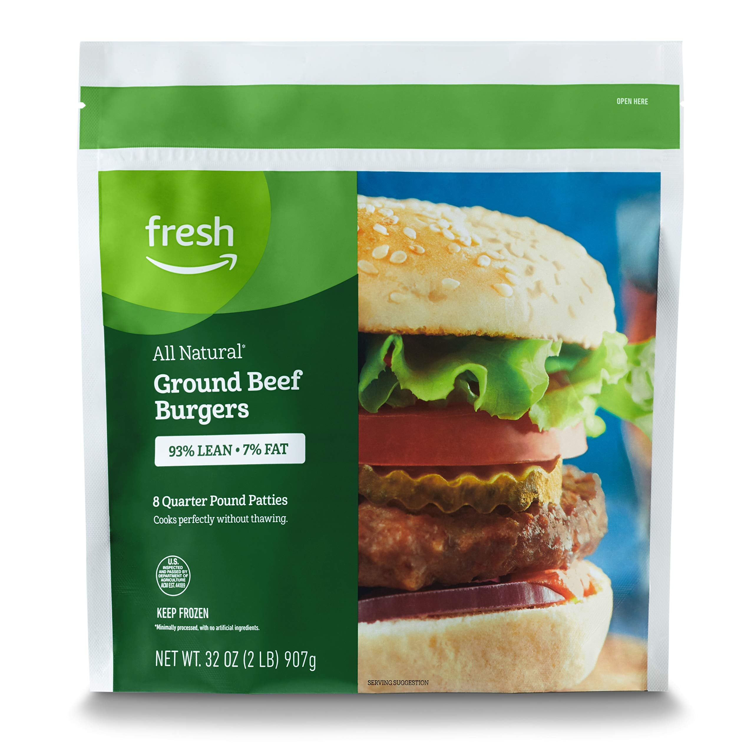A package of Fresh brand All Natural Ground Beef Burgers, 93% lean and 7% fat. The bag shows a close-up of a cooked burger in a bun with lettuce, tomato, and onion. Net weight is 32 oz (2 lb) or 907g.