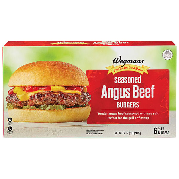 A box of Wegmans seasoned Angus beef burgers, showing a cooked burger with cheese, ketchup, and mustard in a bun. The package advertises six 1/3 lb burgers, seasoned with sea salt.