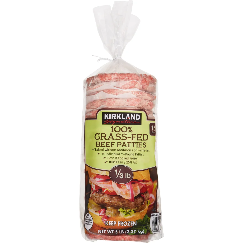 Frozen burger brands. A bag of Kirkland Signature 100% Grass-Fed Beef Patties, 5 lbs. The label highlights no antibiotics or hormones, 1/3 lb patties, and a photo of a cooked hamburger below the text.