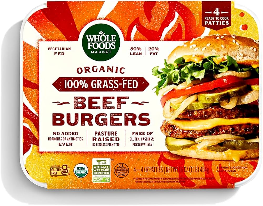 A package of Whole Foods Market organic 100% grass-fed beef burgers, featuring a burger image and labels such as vegetarian fed, pasture raised, 80% lean, free of gluten, and USDA organic.