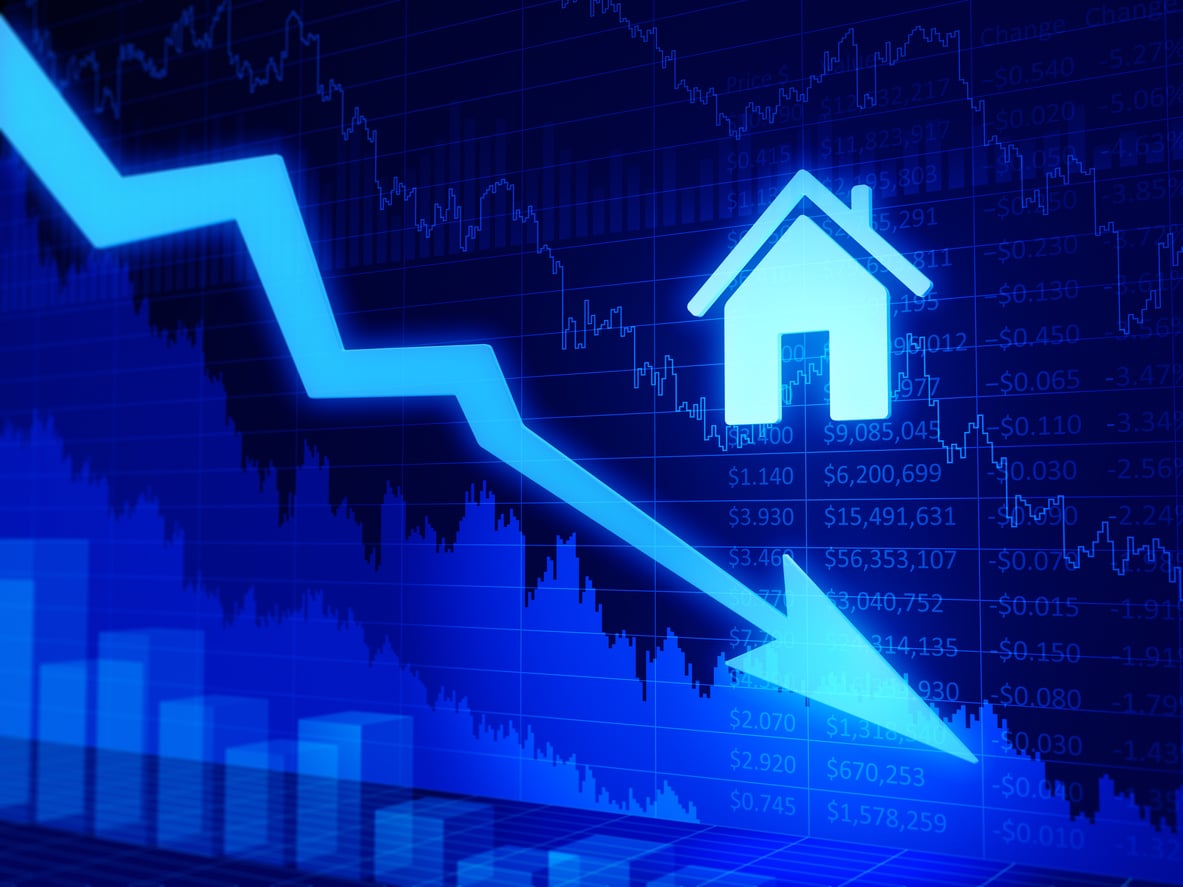 A blue downward trending arrow overlays a financial chart with stock numbers, bar graphs, and a house icon, symbolizing a decline in the real estate market and highlighting the potential benefits of renting during housing downturns.