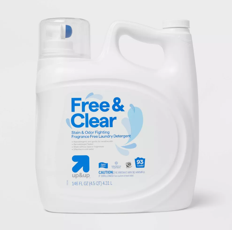 A large white container of up & up Free & Clear fragrance-free laundry detergent with a handle, spout, and blue label text highlighting its stain and odor fighting features. The container holds 146 FL OZ (4.58 QT) or 4.31 L.
