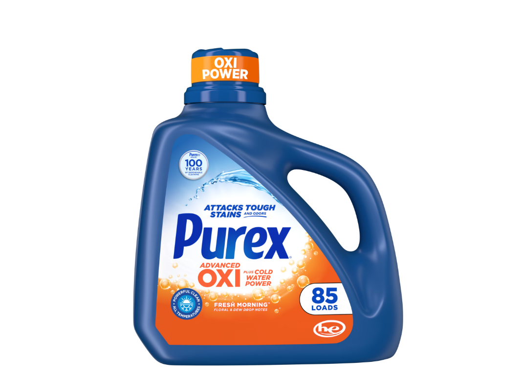 A blue bottle of Purex Advanced Oxi liquid laundry detergent with an orange cap, labeled for 85 loads and Fresh Morning scent. The front highlights Oxi Power and tough stain removal.