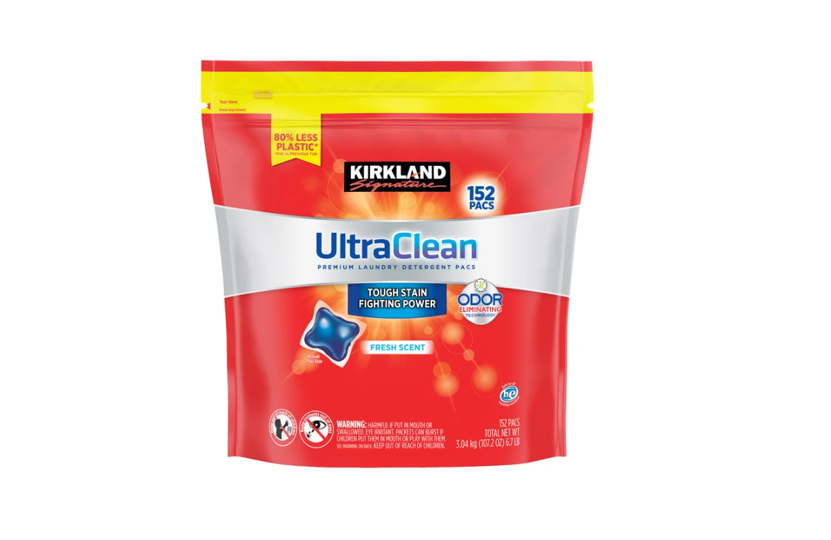 A red and yellow Kirkland Signature UltraClean laundry detergent pack with 152 pods, featuring "Tough Stain Fighting Power" and "Odor Elimination" labels, and a fresh scent icon on the front.