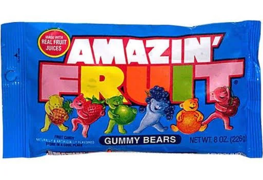 A blue bag of Amazin' Fruit gummy bears featuring colorful, cartoon fruit characters and bold, multicolored text on the front. The bag advertises "Gummy Bears" and "Made with Real Fruit Juices.