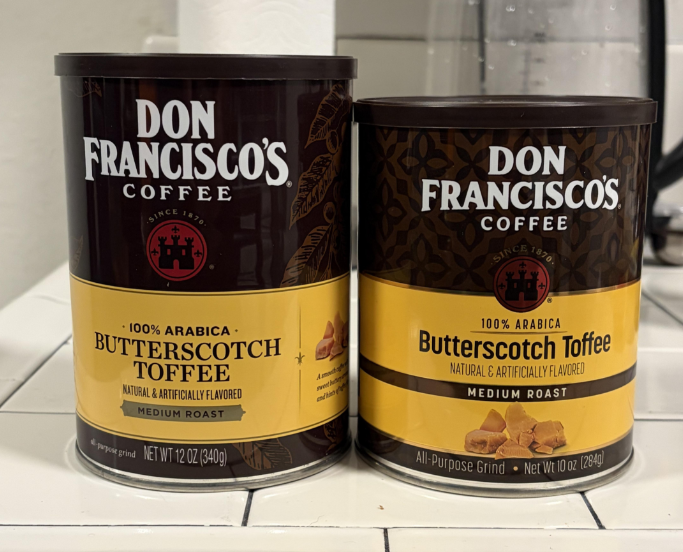 Two cans of Don Francisco's Coffee in Butterscotch Toffee flavor sit on a white kitchen counter. One can is labeled "Butterscotch Toffee" and the other is "Butterscotch Toffee +." These photos of shrinking products highlight subtle differences in packaging that coffee lovers may notice over time.