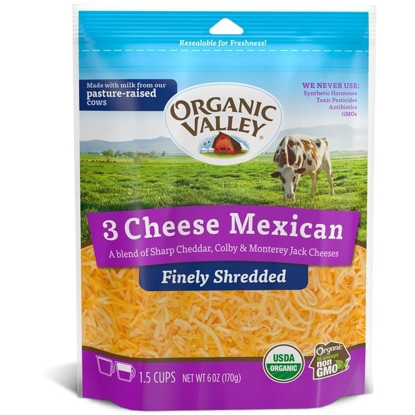 A bag of Organic Valley 3 Cheese Mexican Finely Shredded cheese, featuring sharp cheddar, colby, and Monterey jack—one of the best shredded cheese blends for adding bold flavor to your favorite dishes. The packaging highlights pasture-raised cows and proudly displays USDA Organic and non-GMO labels.