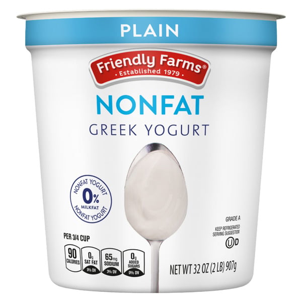 A 32-ounce container of Friendly Farms Nonfat Greek Yogurt, Plain flavor. The label shows a spoon, nutrition facts, “0% Milkfat,” and the brand's red and blue logo.