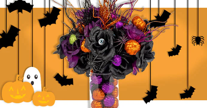 Dollar Tree Halloween finds. A Halloween-themed bouquet with black and purple flowers, glittery pumpkins, and spooky accents in a vase. Background features bats, pumpkins, a ghost, and a hanging spider on an orange backdrop.