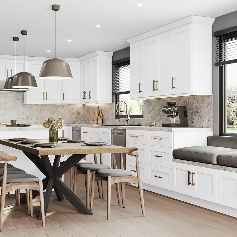 Modern kitchen with white cabinets, marble backsplash, stainless steel appliances, a wooden dining table with chairs, pendant lights, and a cozy window seat with gray cushions—these stylish home features are bathed in natural light from large windows.