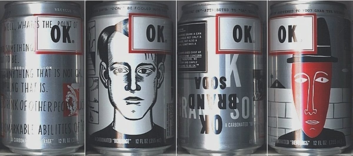 Four Soda Pops cans labeled “OK.” with unique black, white, and red illustrated designs, including portraits and abstract art. Text and graphics wrap around each can, creating a quirky, artistic appearance.