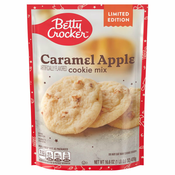 A Betty Crocker limited edition Caramel Apple cookie mix pouch with images of cookies on the front. The package is red, white, and gold with nutritional info at the bottom.