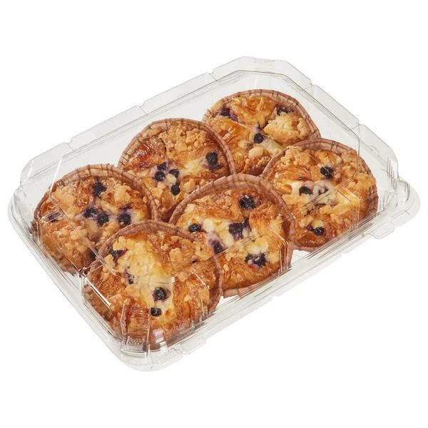 A clear plastic container holds six blueberry cheese danishes, each with a golden, flaky crust and visible blueberries and cheese filling.