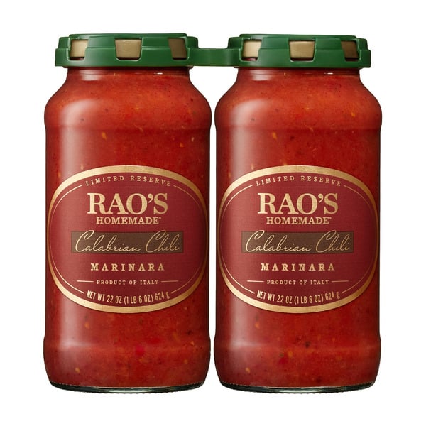Two jars of Rao’s Homemade Calabrian Chili Marinara sauce with green lids and gold labels, filled with red sauce and visible chili flakes.