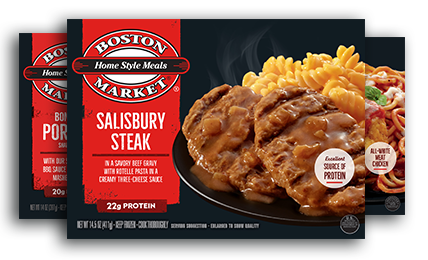 Boston Market Salisbury Steak meal box showing two Salisbury steaks with gravy, rotini pasta in creamy cheese sauce, and product branding on a red and black package design.