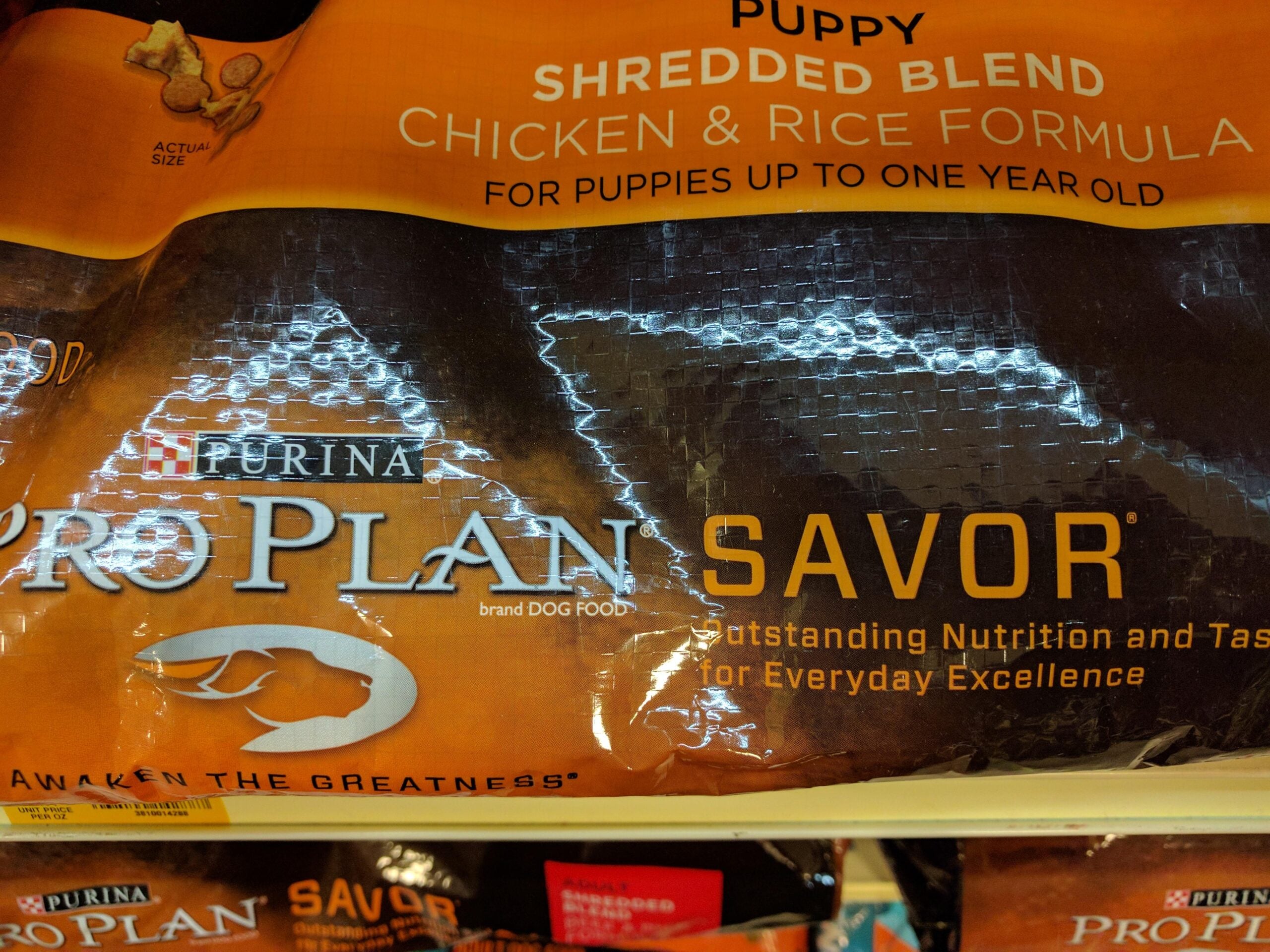 Bag of Purina Pro Plan Savor Puppy Shredded Blend Chicken & Rice Formula dog food for puppies up to one year old, featuring branding and slogan.