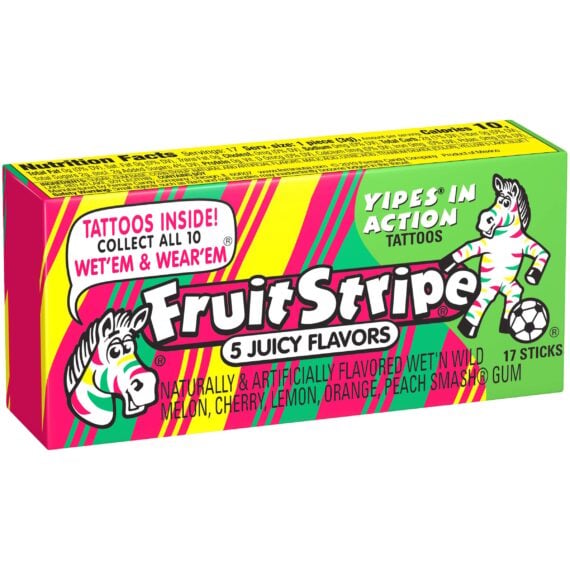 A colorful box of Fruit Stripe gum with a zebra mascot, advertising &ldquo;5 Juicy Flavors&rdquo; and tattoos inside. The flavors listed are melon, cherry, lemon, orange, and peach smash.