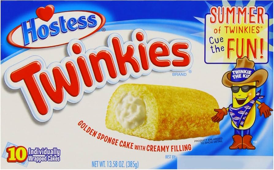 Box of Hostess Twinkies featuring a golden sponge cake with creamy filling, a cartoon Twinkie mascot in a cowboy hat, and text saying “Summer of Twinkies Cue the Fun!”