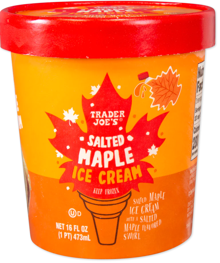 A pint container of Trader Joe’s Salted Maple Ice Cream with a red lid and autumn leaf design, featuring text and maple leaf graphics on an orange background.