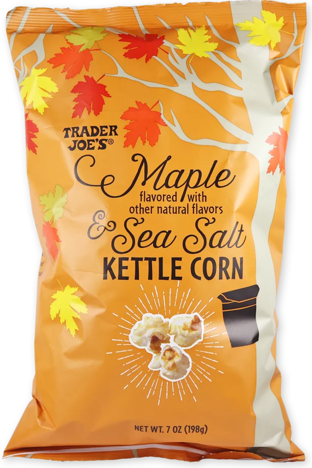 A bag of Trader Joe’s Maple & Sea Salt Kettle Corn, decorated with red, yellow, and orange autumn leaves, and images of kettle corn. The bag is orange and beige, weighing 7 oz (198g).