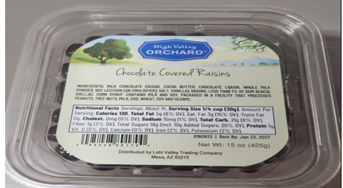 A clear plastic container labeled “High Valley Orchard Chocolate Covered Raisins” with nutritional facts, ingredients, and company information visible on its label. The container holds 15 oz (425g) and has a “Best By” date.