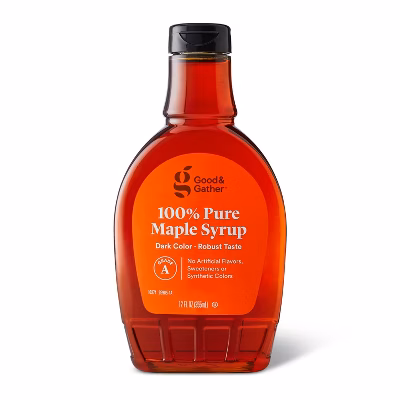 A bottle of Good & Gather 100% Pure Maple Syrup with a red label, dark amber syrup inside, and a black cap. The label highlights “Dark Color - Robust Taste” and “No artificial flavors, sweeteners, or synthetic colors.”