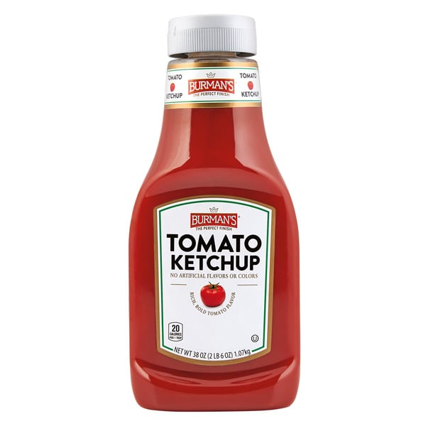 A plastic bottle of Burman’s Tomato Ketchup with a white label and red cap, showing nutrition facts and “No Artificial Flavors or Colors” text on the front.