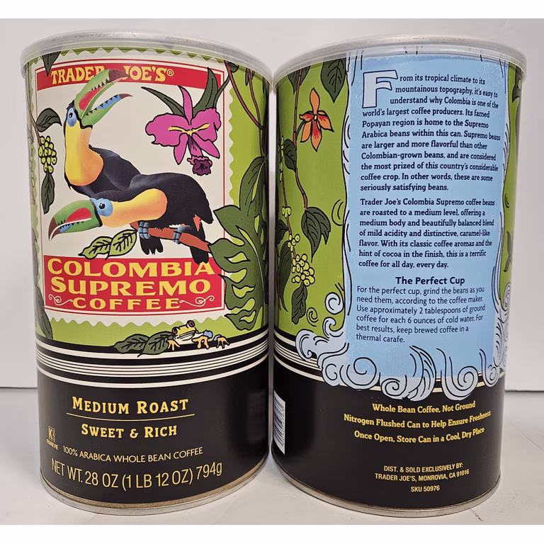 Two Trader Joe’s coffee canisters with colorful toucan artwork. The front reads “Colombia Supremo Coffee, Medium Roast, Sweet & Rich.” The back provides product information and brewing instructions on a green and black background. Best store brand products.