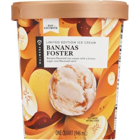 A tub of Premium Bananas Foster ice cream with a gold and orange design, showing banana slices and a scoop of the ice cream on the front. The label highlights it’s a limited edition, banana-flavored dessert.