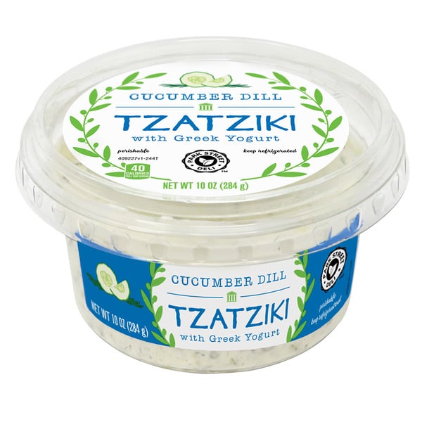 A 10 oz container of cucumber dill tzatziki with Greek yogurt, featuring a clear lid and green accents. The label includes a cucumber illustration and states 40 calories per serving.