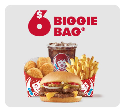 Wendy’s $6 Biggie Bag featuring a cheeseburger, chicken nuggets, French fries, and a soft drink in branded packaging, all displayed on a white background.