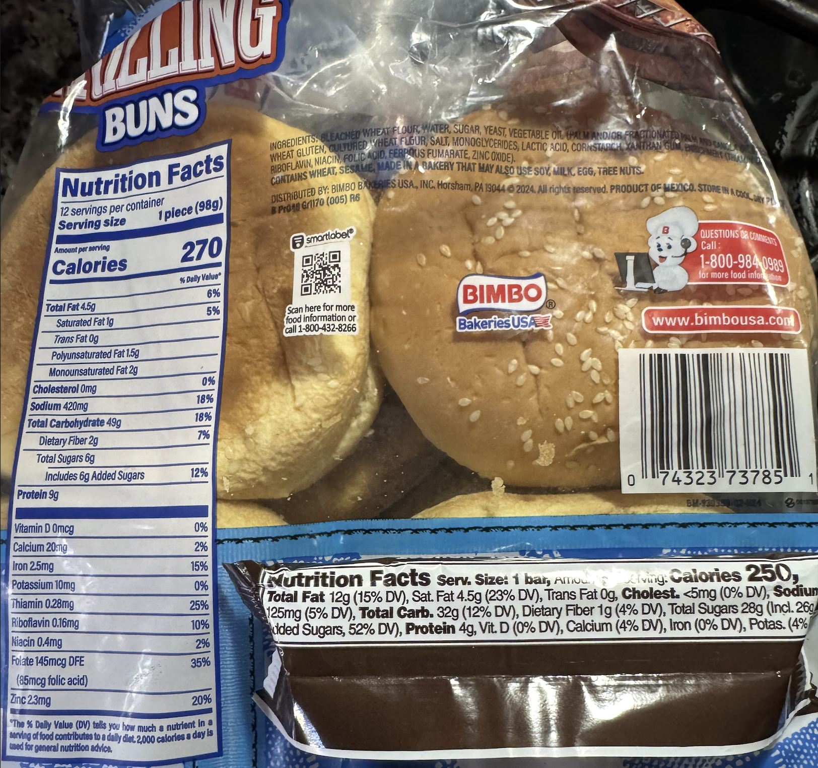 A package of Bimbo hamburger buns with visible nutrition facts label, sesame seed tops, barcode, and customer service contact information.