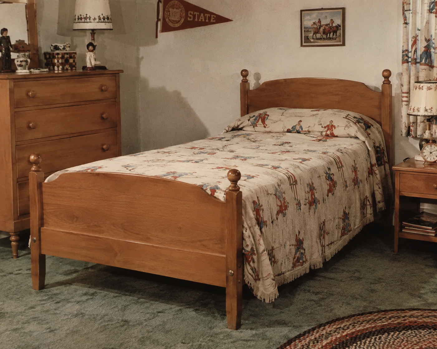 A wooden twin bed with a cowboy-patterned bedspread in a vintage bedroom, featuring a dresser, nightstand, western-themed decor, and an “Oklahoma State” pennant on the wall. Kids' bedrooms in the 1950s.