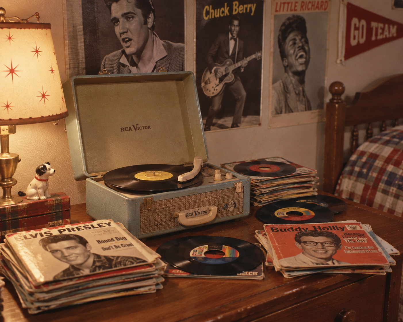 A vintage RCA Victor record player on a wooden table with vinyl records, Elvis Presley and Buddy Holly album covers, and 1950s music posters on the wall in a cozy bedroom.