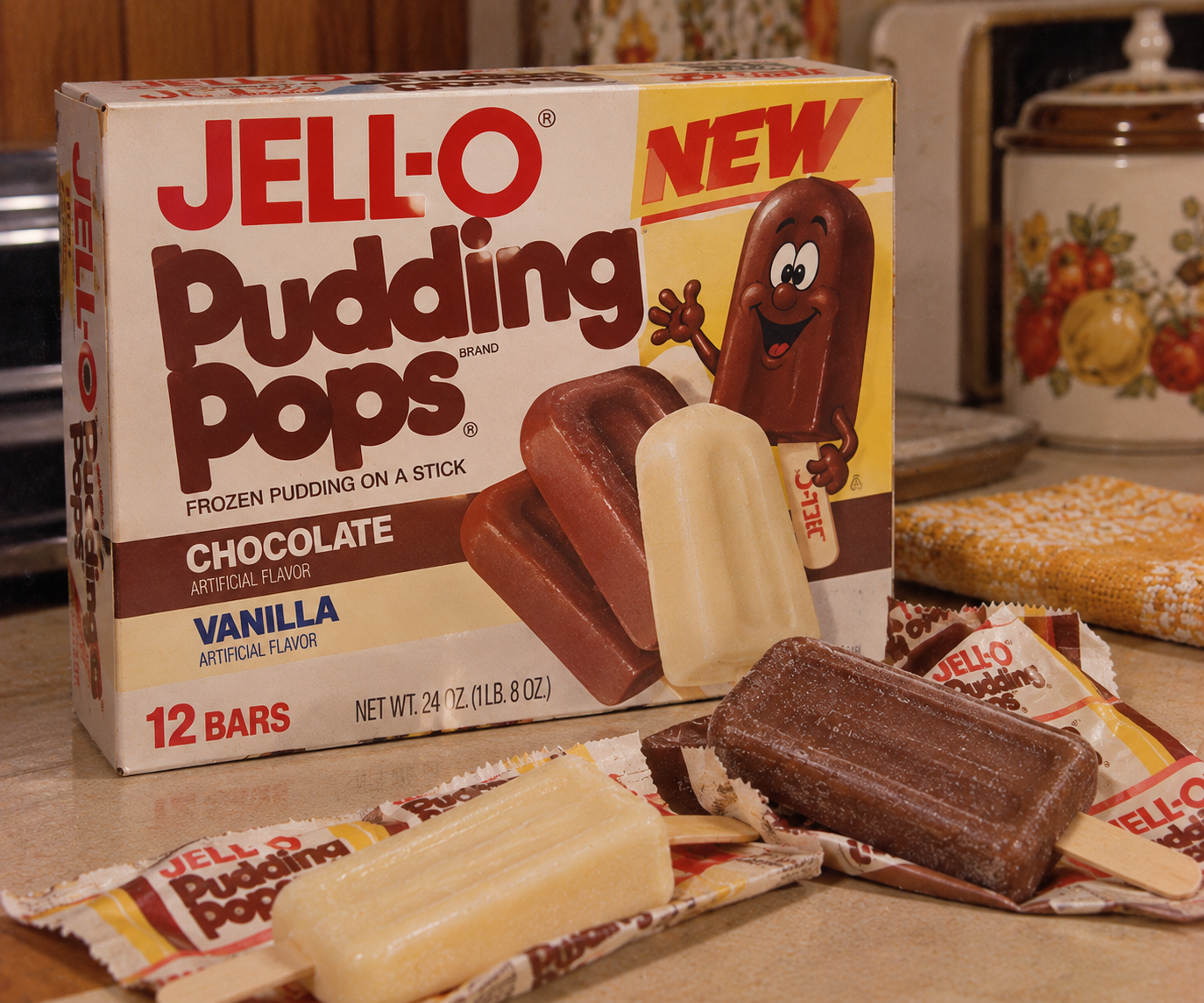 A box of Jell-O Pudding Pops sits on a kitchen counter with unwrapped chocolate and vanilla pops in front, their wrappers nearby—a nostalgic nod to 1980s grocery store staples in a retro kitchen setting.