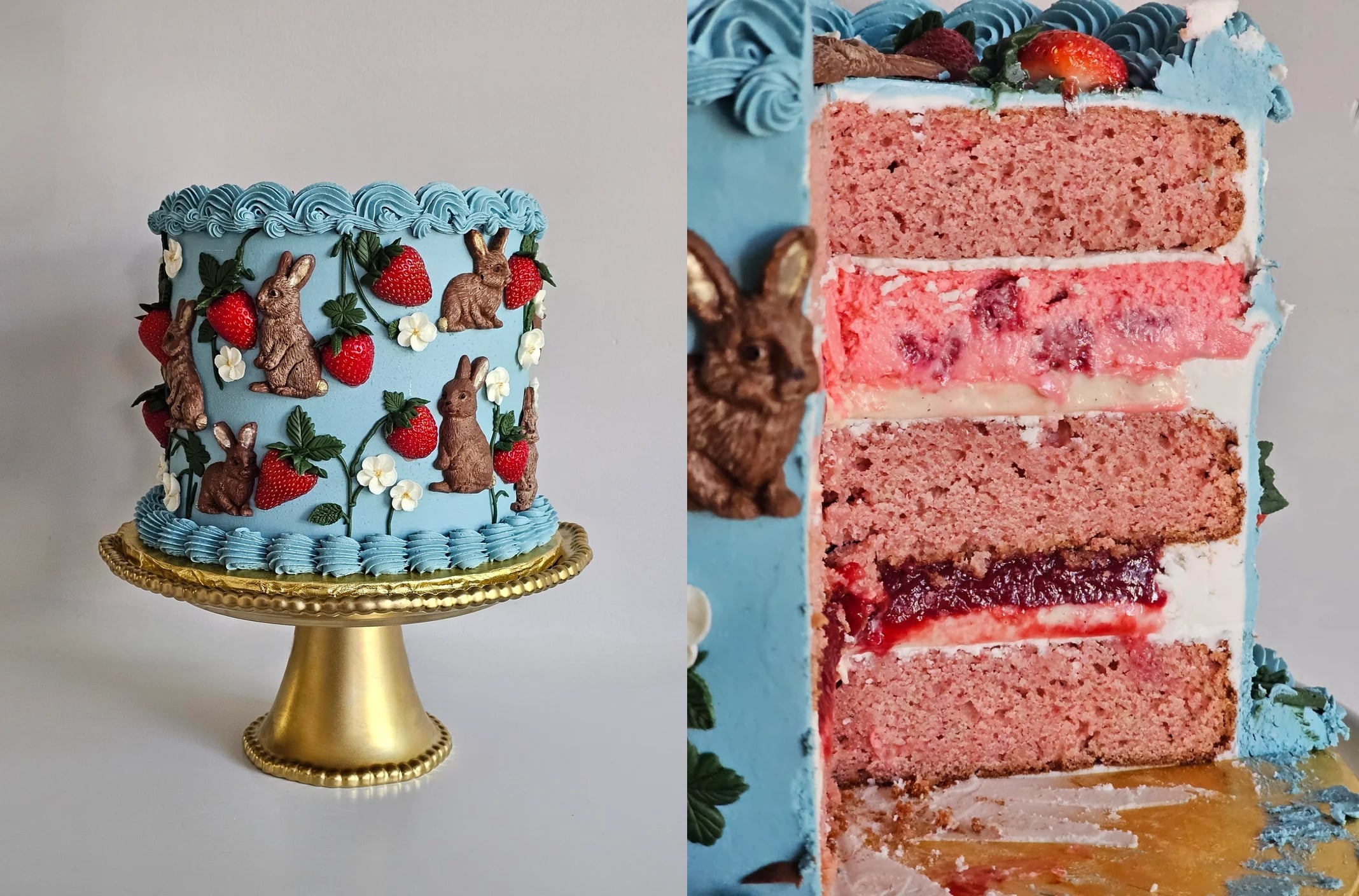 A blue frosted cake decorated with chocolate bunnies, strawberries, and white flowers sits on a gold stand—an eye-catching centerpiece for lovers of Decadent Desserts. A slice reveals pink layers, white filling, and red jam inside.