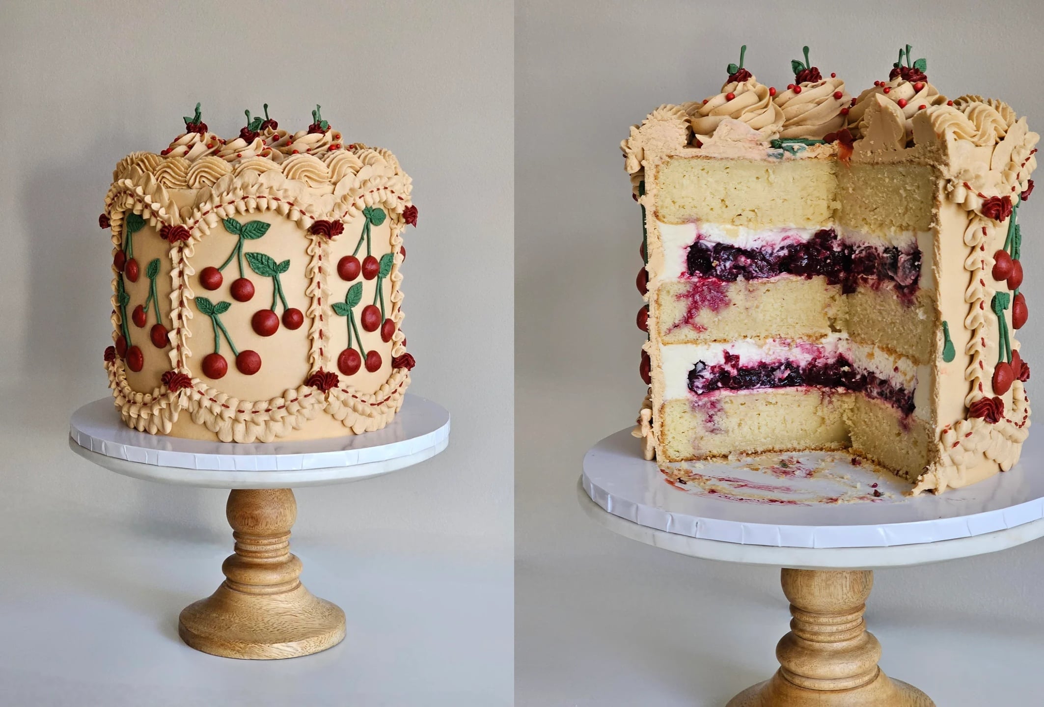 A tall cake with tan frosting, cherry decorations, and ornate piping sits on a wooden stand—a true centerpiece for lovers of Decadent Desserts. A slice reveals vanilla layers filled with dark cherry and cream fillings.