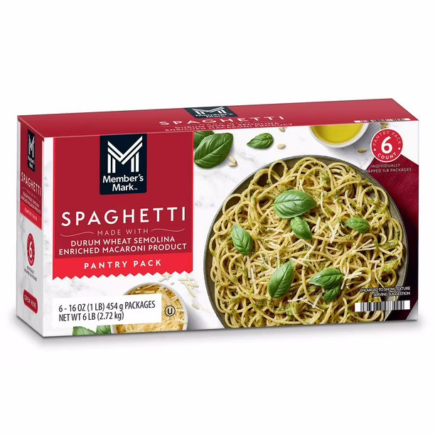 A box of Member’s Mark Spaghetti pantry pack showing cooked spaghetti with basil leaves on a white plate. The box contains six 16 oz packages, weighing 6 lbs in total.
