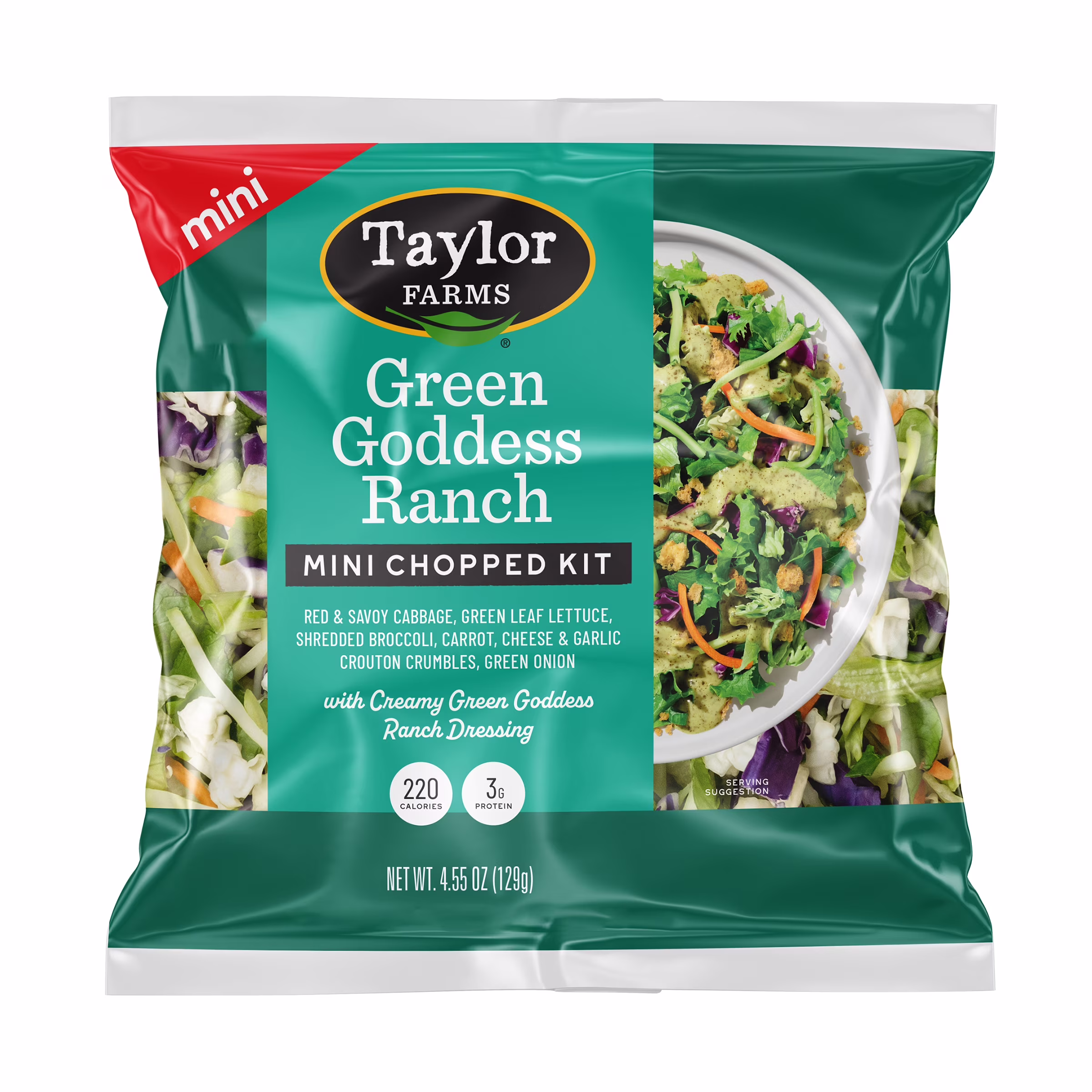 A bag of Taylor Farms Green Goddess Ranch Mini Chopped Kit, showing a salad mix with cabbage, lettuce, carrots, cheese, green onion, croutons, and dressing. The package is teal and green with nutrition info.