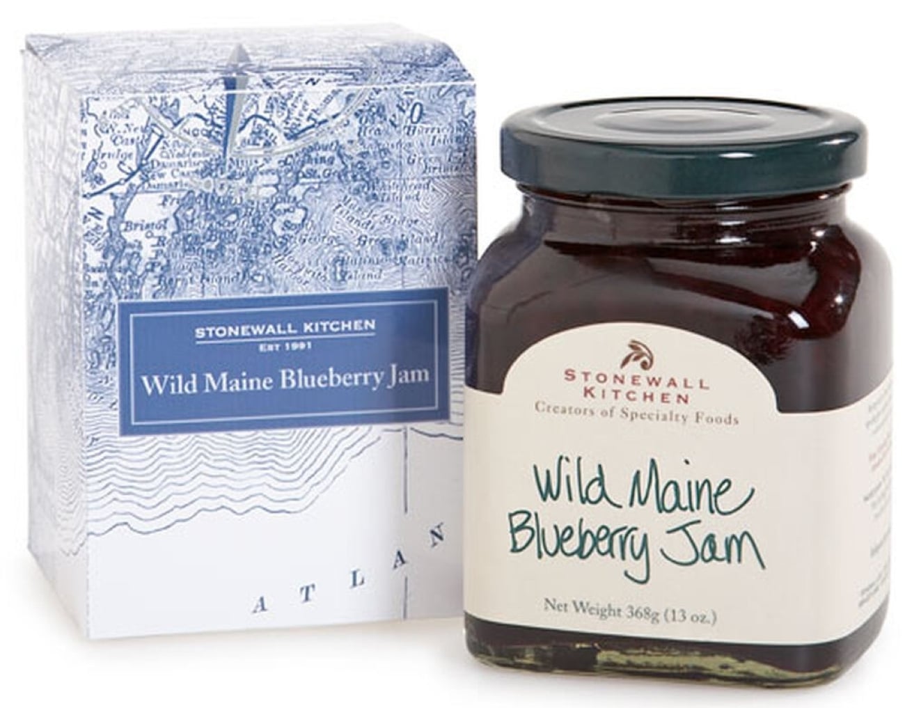Stonewall Kitchen Wild Maine Blueberry Jam in a glass jar next to its decorative blue and white map-patterned box, a best souvenir choice.