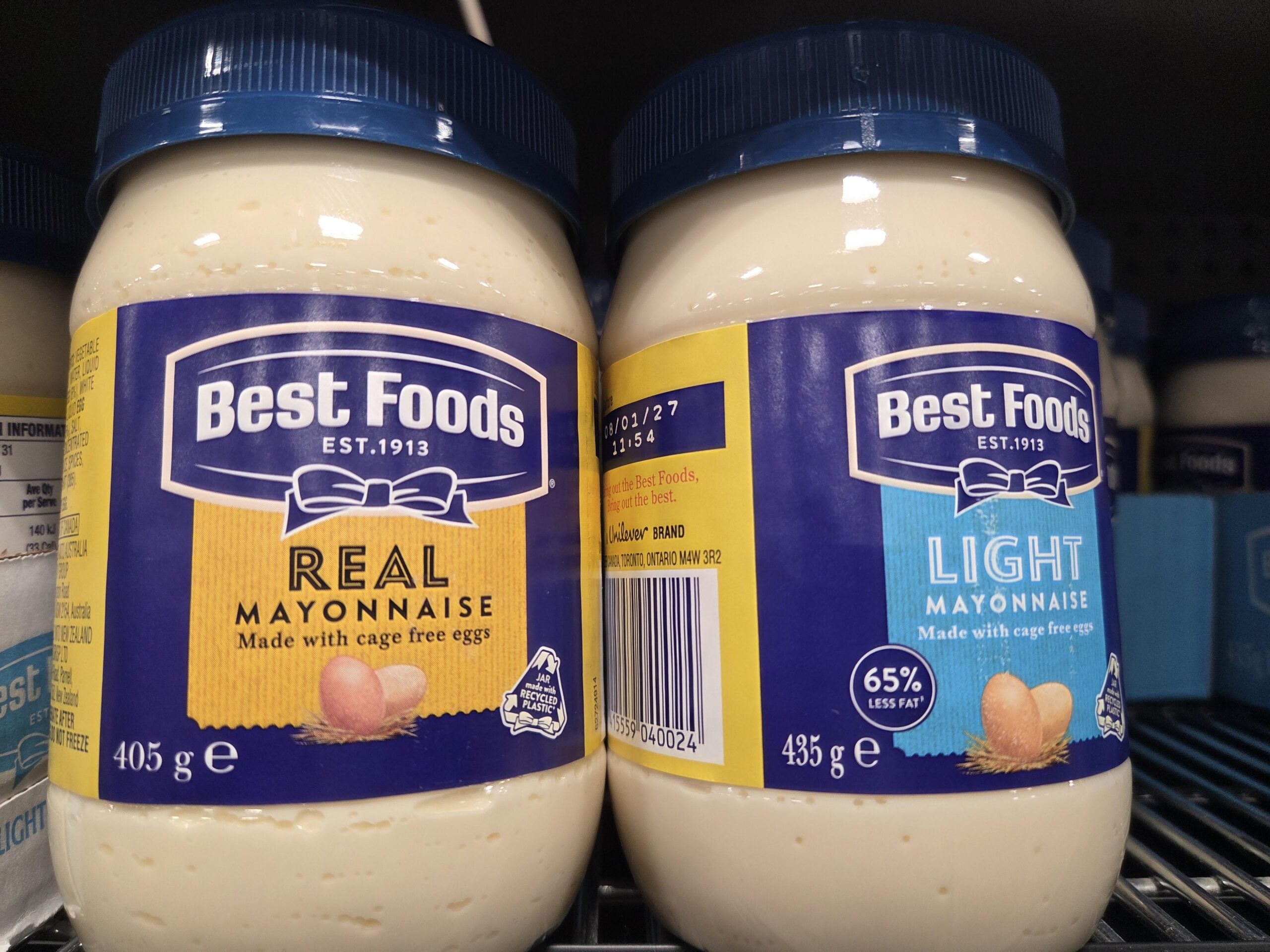 Two jars of Best Foods mayonnaise on a store shelf, one labeled Real Mayonnaise and the other labeled Light Mayonnaise.