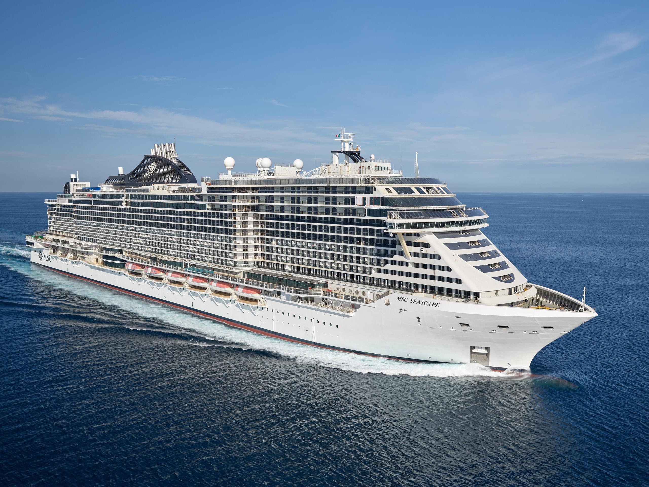 The MSC Seascape cruise ship sailing on the open ocean, with views visible from its onboard cruise ship buffets.