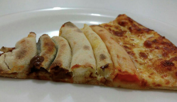 A slice of cheese pizza with a crust stuffed with various fillings.