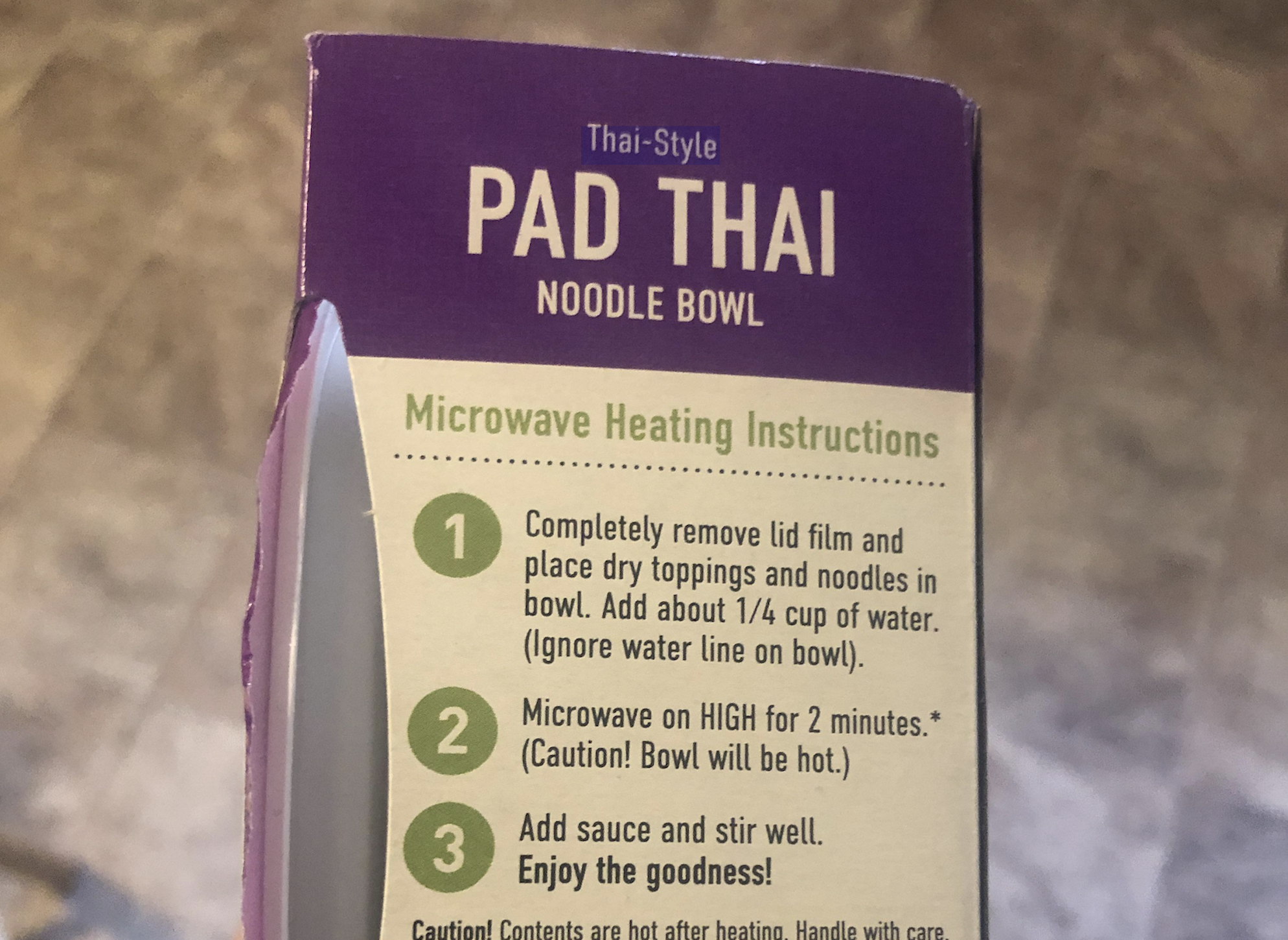 Thai-Style Pad Thai Noodle Bowl microwave heating instructions, featuring a three-step guide to preparing the meal.