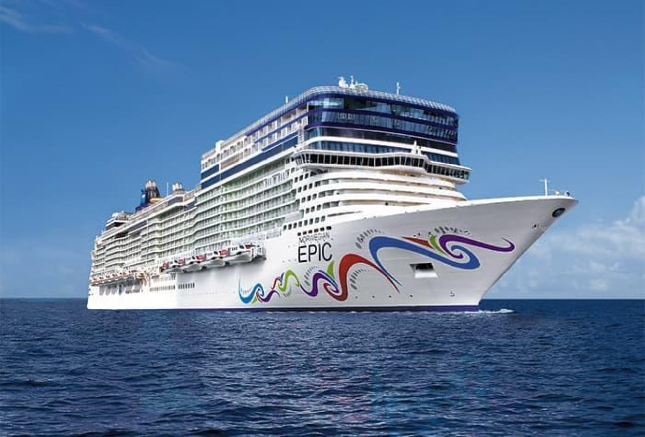 The Norwegian Epic cruise ship sails on the ocean, where passengers enjoy the ship’s cruise ship buffets.