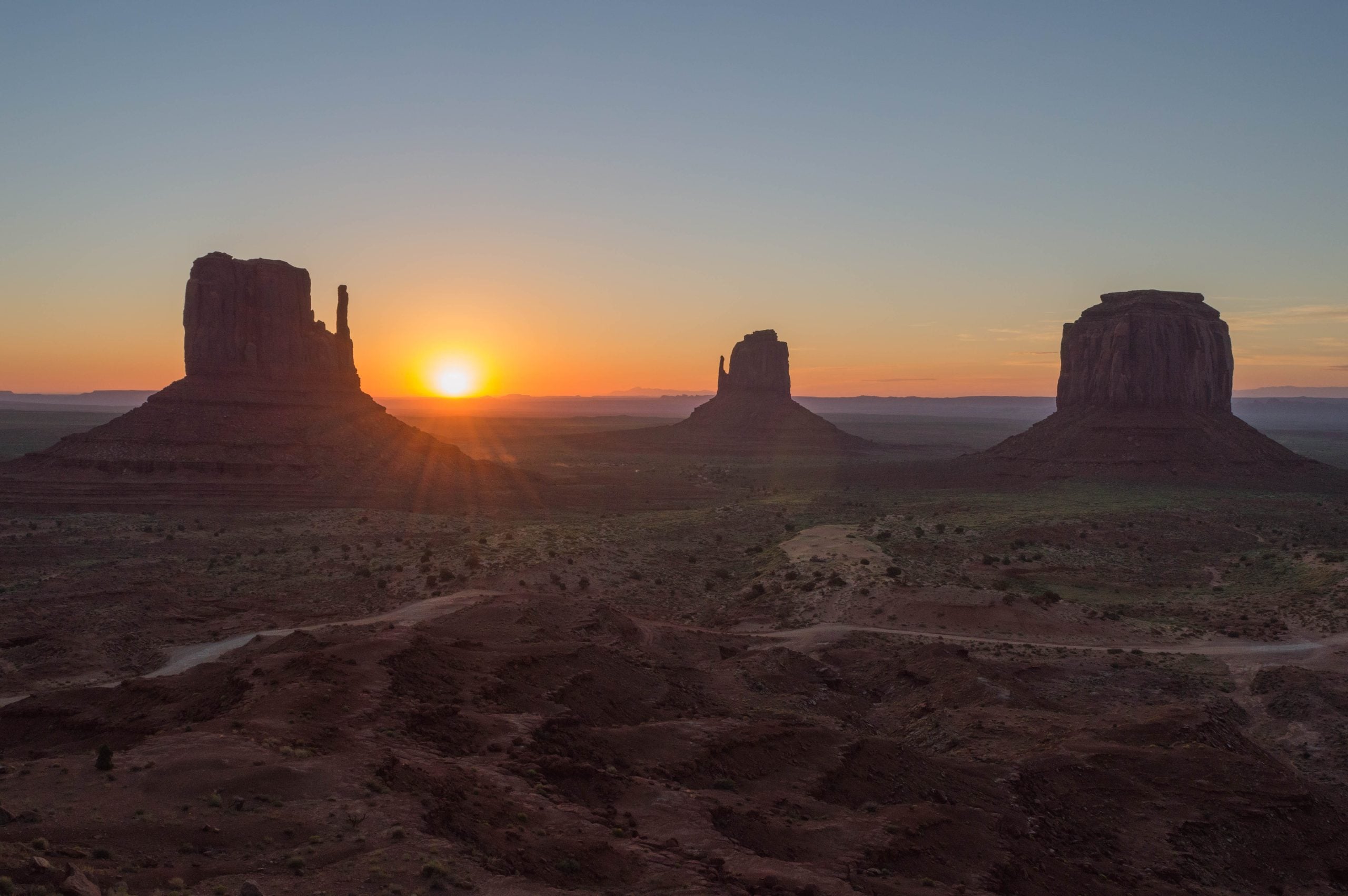 Sunrise over the rock formations of Monument Valley.
