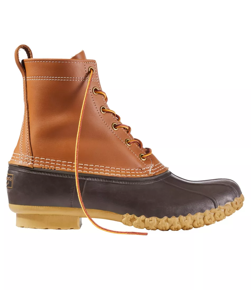 Tan leather lace-up boot with a dark brown rubber base and a textured tan sole.