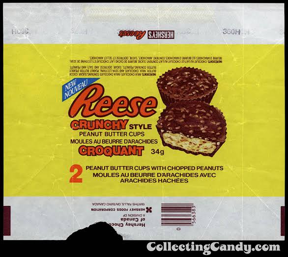 Wrapper for Reese’s Crunchy Style peanut butter cups featuring the product name, a graphic of two cups, and English and French text. 80s Halloween candy.