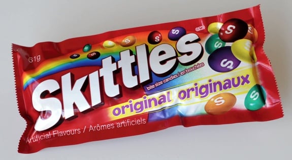 A single-serving bag of Original Skittles candies.