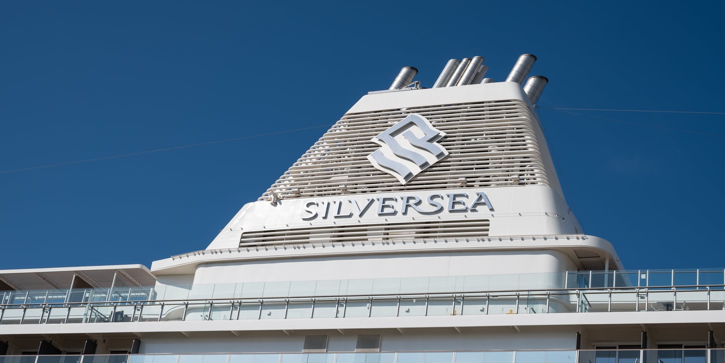 The funnel of a Silversea cruise ship set against a clear blue sky, a signature icon of the vessel’s cruise entertainment experience.